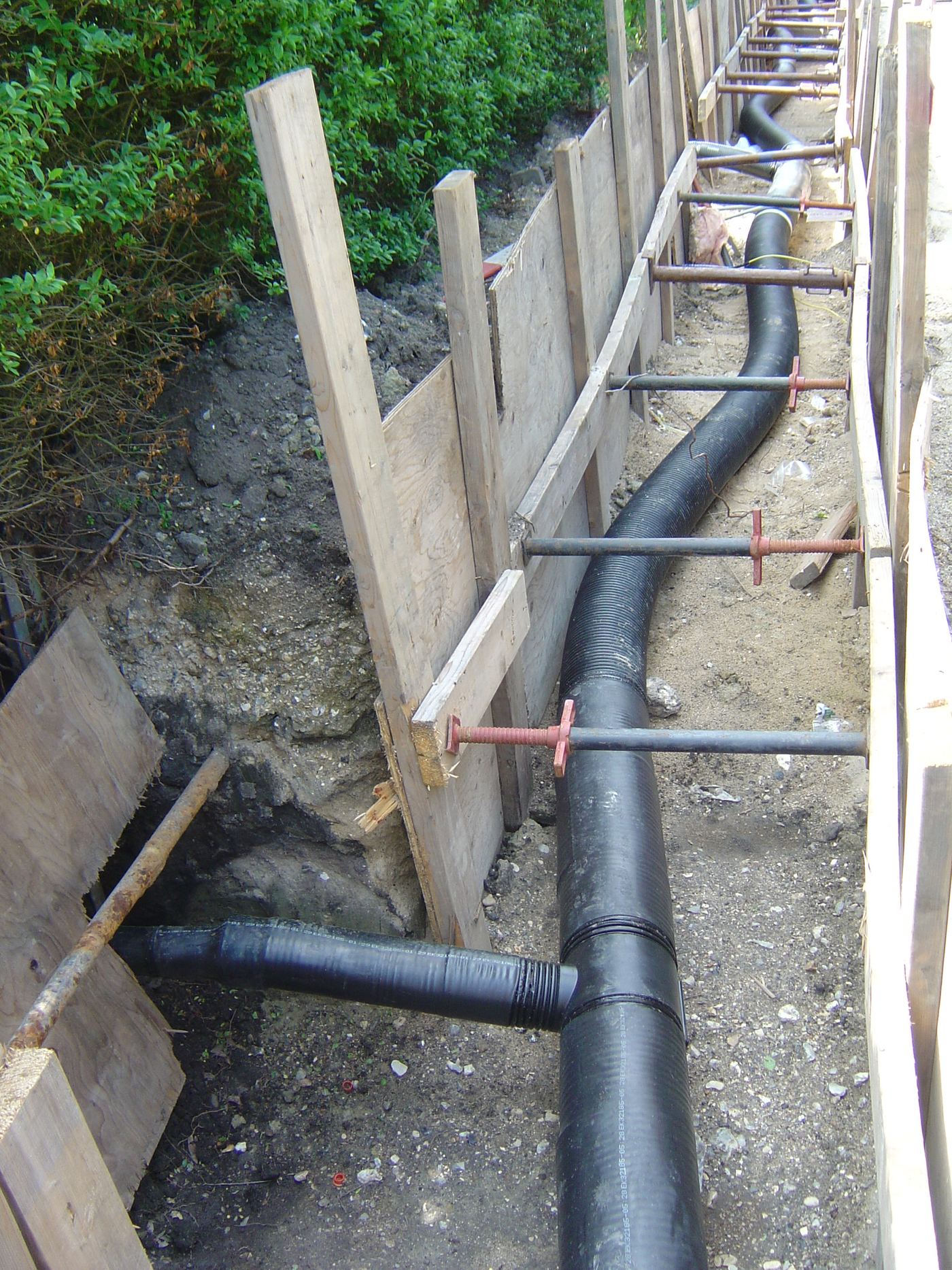 A district heating pipe being laid through a garden allotment area on Amager, Copenhagen, 2007