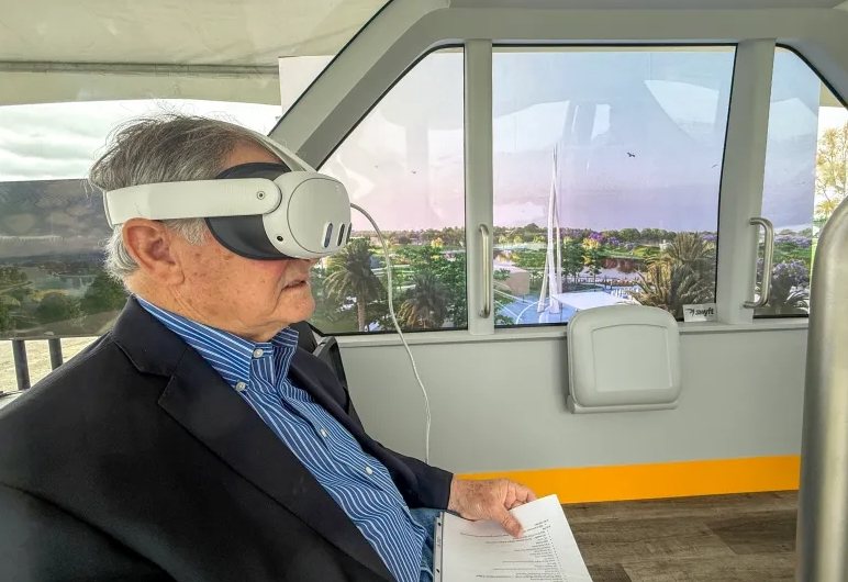 Irvine residents seated in a Whoosh vehicle mock-up trying a virtual-reality ride